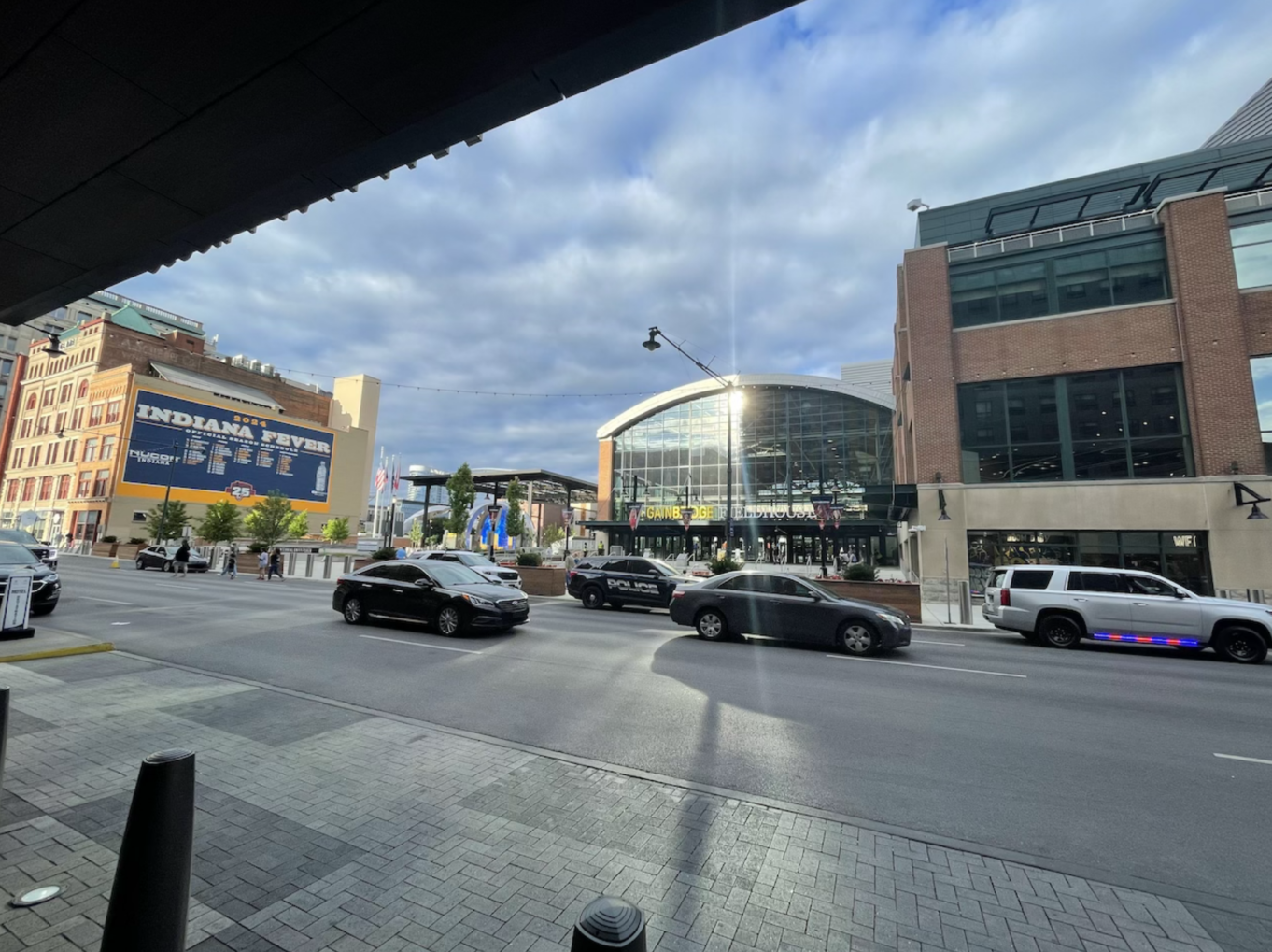 a street with cars and buildings on the side